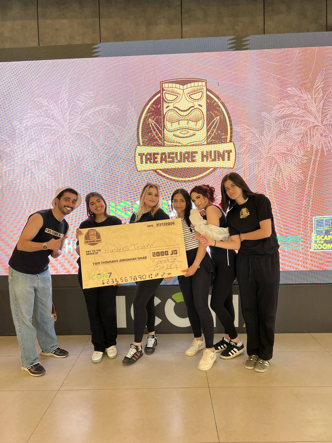 Second Treasure Hunt winners celebrating with the prize