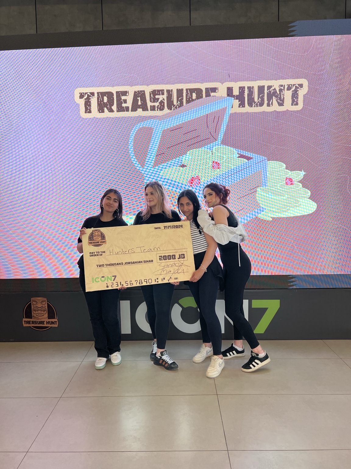 Second Treasure Hunt winners celebrating with the prize